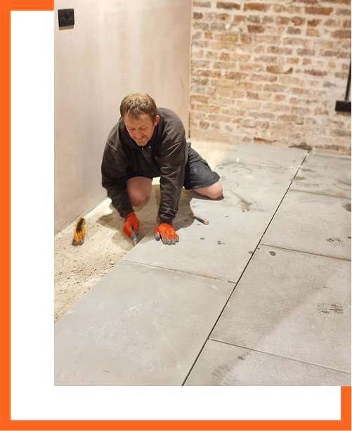 Stonemason laying limestone flooring