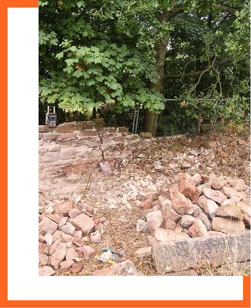 Weathered boundary wall being dismantled and sorted